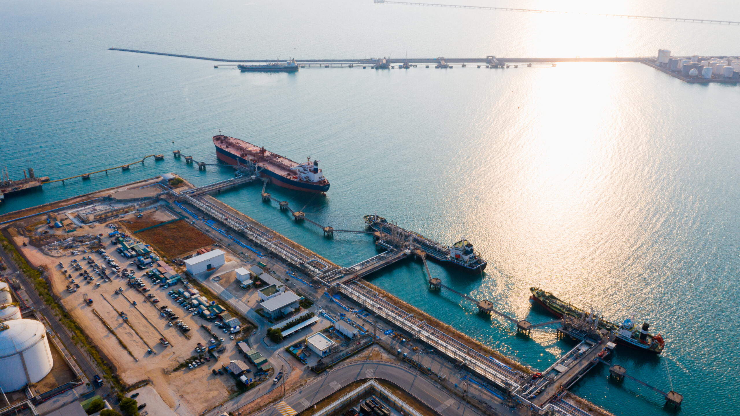 Oil refinery of business logistic sea going ship, the natural gas pipeline for oil delivery ships. to Port of europe-Cargo ship import export, international order concept.